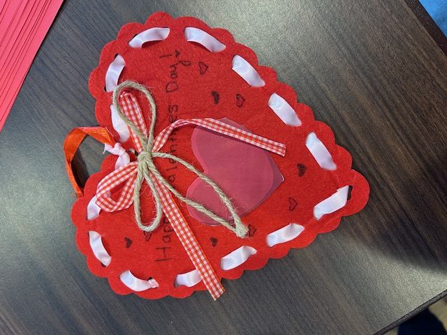 Felt heart craft with a gingham bow reading "Happy Valentine's Day!"