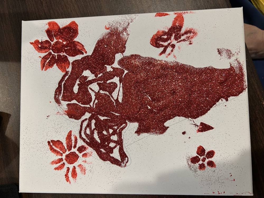 Glitter floral canvas painting from a craft session