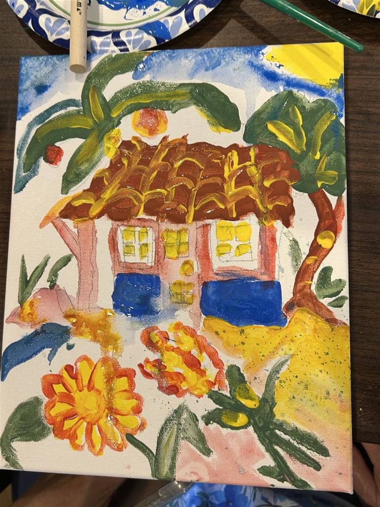 Canvas painting of a cottage surrounded by flowers