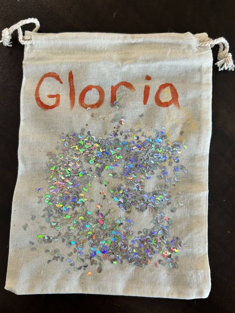 Personalized drawstring bag reading 'Gloria' with a glitter heart